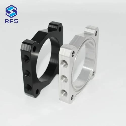 Isometric view showing side mounting holes of black and silver steel spacers
