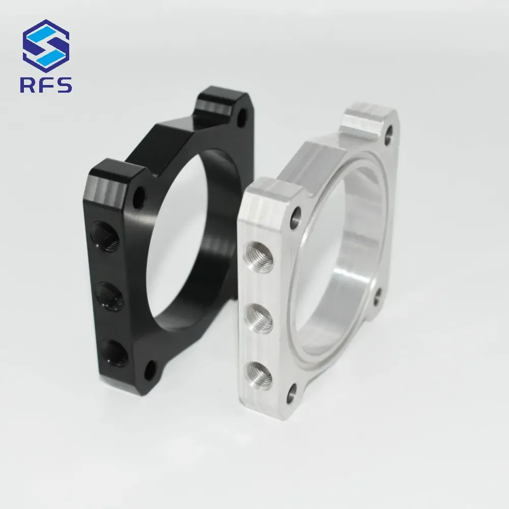 Isometric view showing side mounting holes of black and silver steel spacers